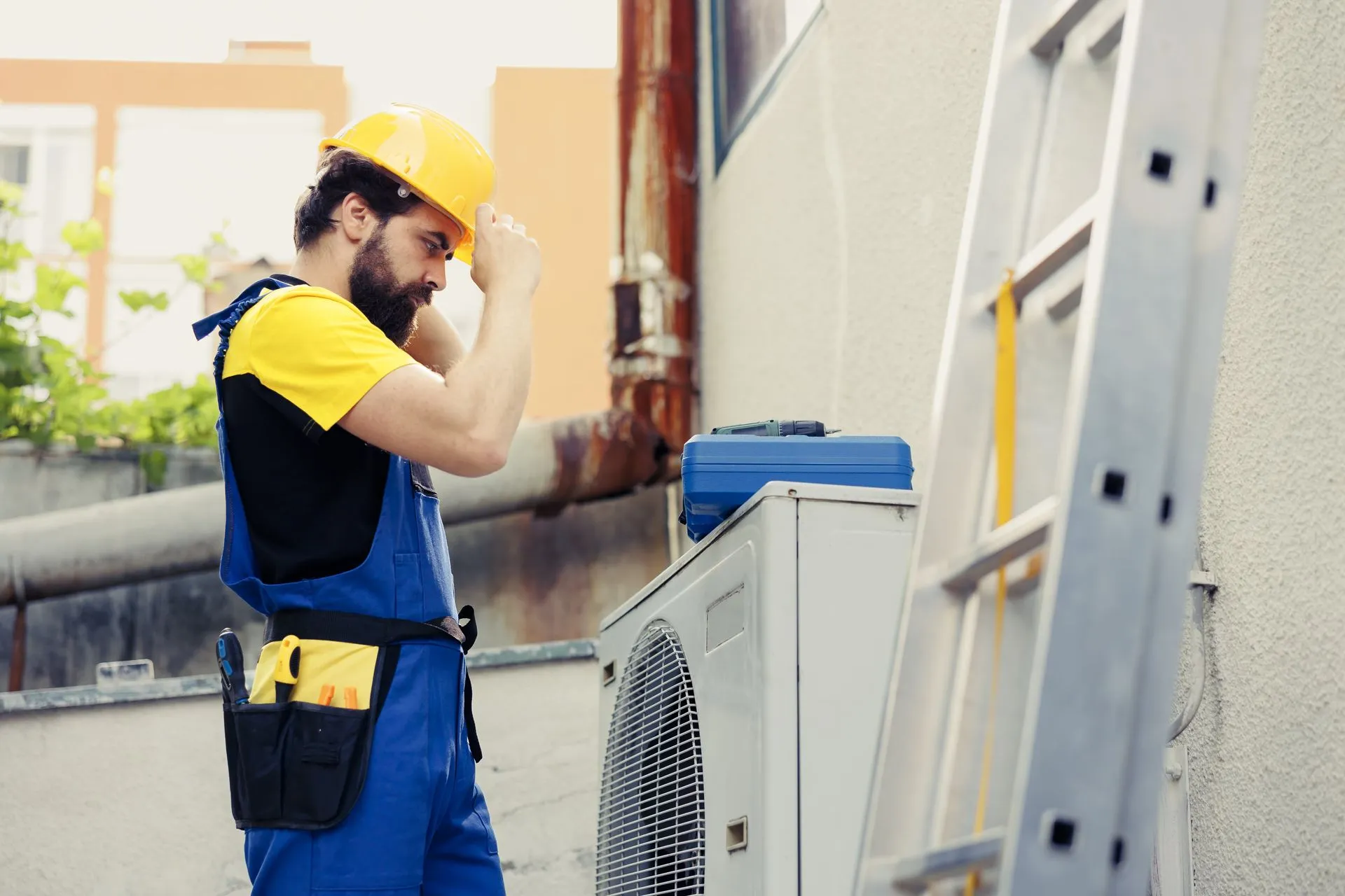 Technician diagnosing a residential air conditioner with a multimeter.