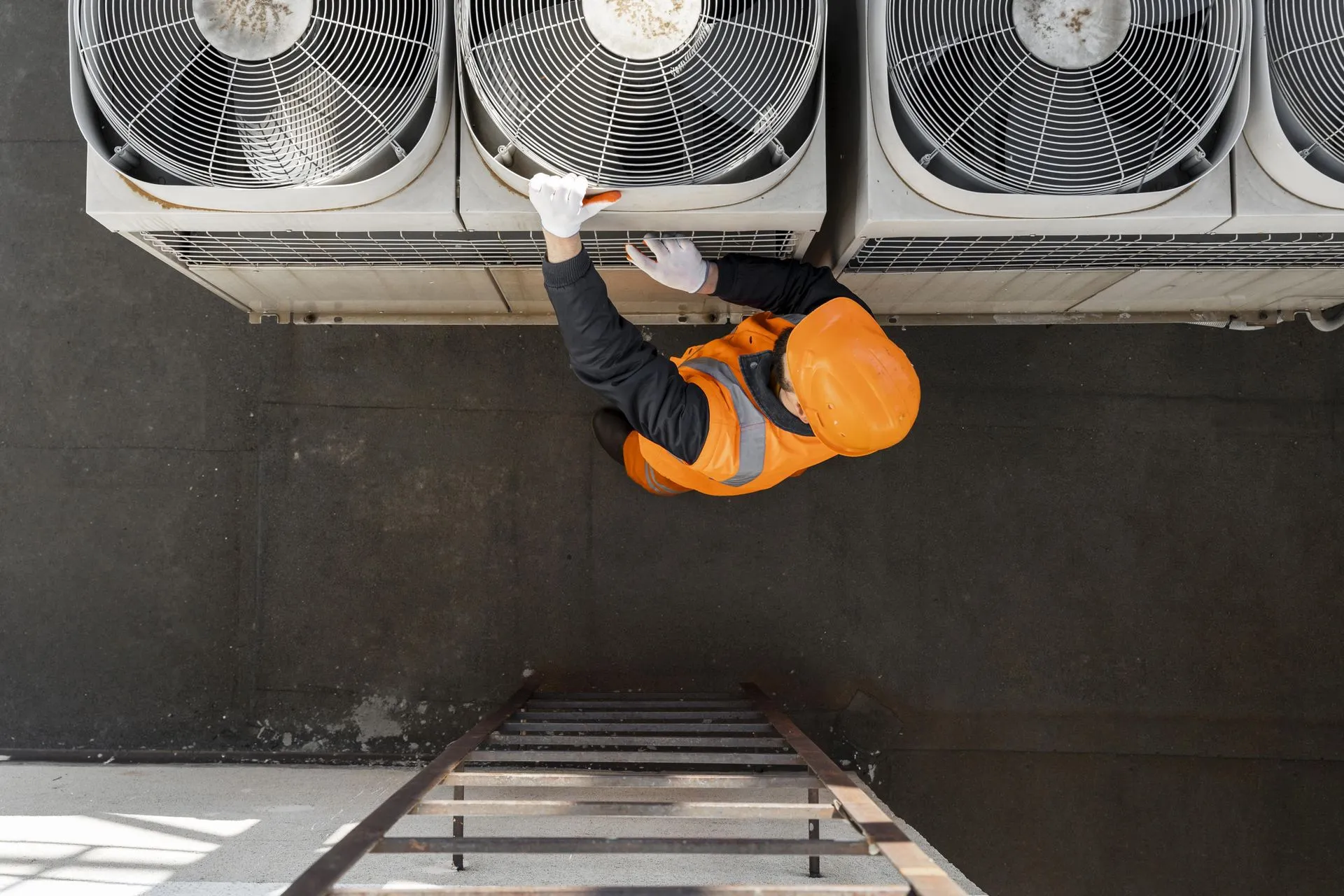 A technician from Reid Heating & Air performing a commercial HVAC soultion